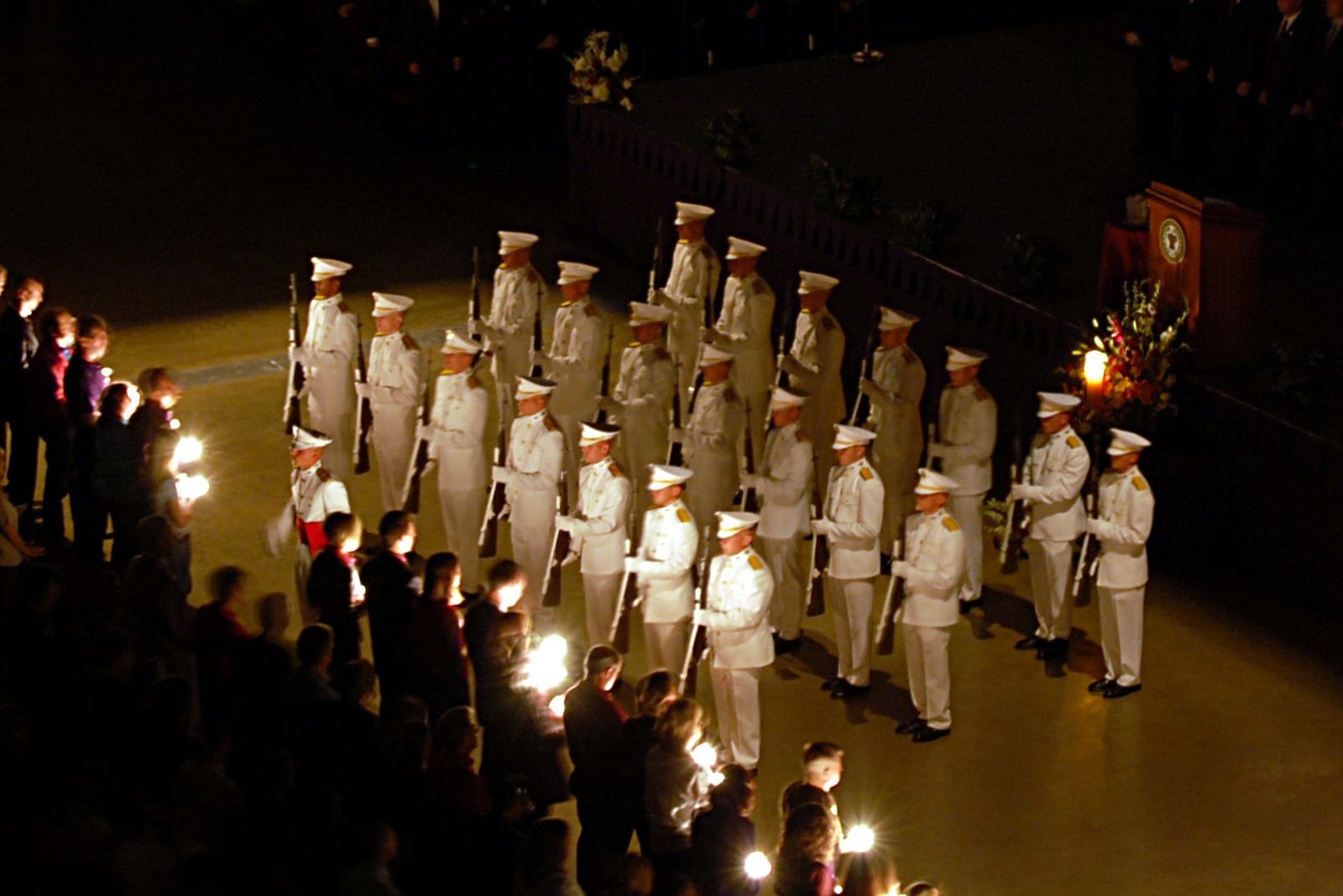 Cadets holding candles at Texas A&M Campus Muster